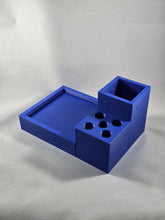 Load image into Gallery viewer, Blue modular desk organizer components arranged on a white textured fabric background. The set includes a shallow rectangular tray, a square open-top container, and a section with four circular compartments designed to hold small items. The pieces fit together in an L-shaped configuration and feature small holes along the sides, suggesting modular assembly or mounting. The image is photographed from an elevated angle, showing the interior compartments and overall layout of the organizer.